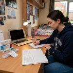 university student organising medication and healthcare information